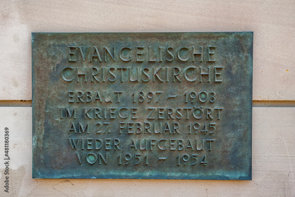 Close-up view of the memorial wall plaque at the Christuskirche (Christ Church) in Mainz, Germany. A reminder of the built between 1897 and 1903, and the reconstruction between 1951 and 1954.