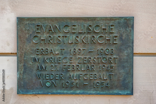 Close-up view of the memorial wall plaque at the Christuskirche (Christ Church) in Mainz, Germany. A reminder of the built between 1897 and 1903, and the reconstruction between 1951 and 1954.