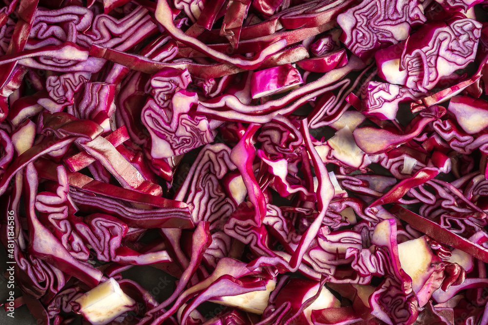 cut purple cabbage slices closeup background