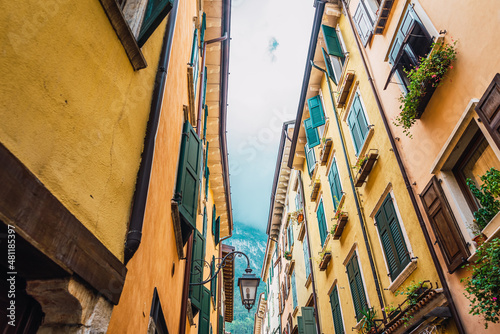 Fototapeta Naklejka Na Ścianę i Meble -  Old and narrow streets of beautiful typical Italian colors on a winter day without tourists.