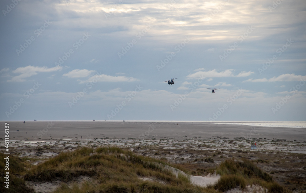Chinook helicopters flying over the beach Chinook helicopters flying over the beach