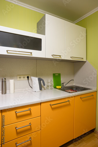 kitchen set consisting of cabinets and countertops with utensils