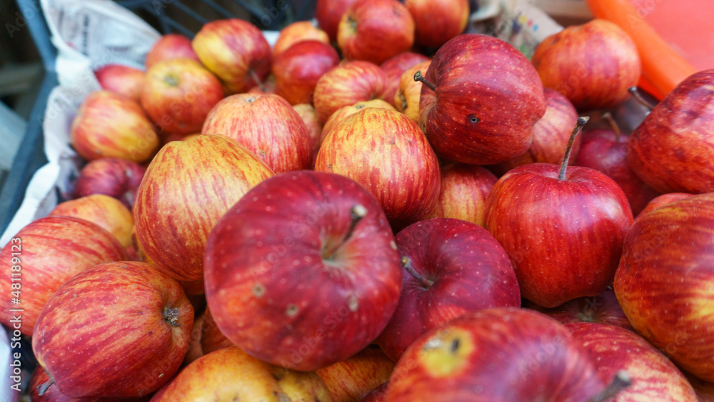 Red apples on village bazaar bench, organic red apples close up. Agricultural clean eating concept for beautiful wallpaper. Vitamin supply for strong and good health. Red apples on village bazaar bench, organic red apples close up. Agricultural clean eating concept for beautiful wallpaper. Vitamin supply for strong and good health.