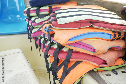stack of life jacket in a boat 