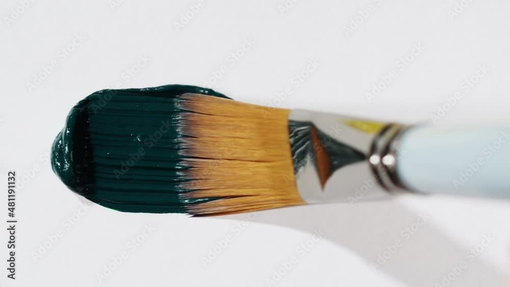 Brush painting with dark green color close-up, art concept. acrylic paint or fluid liquid ink, drawing watercolor abstract background.