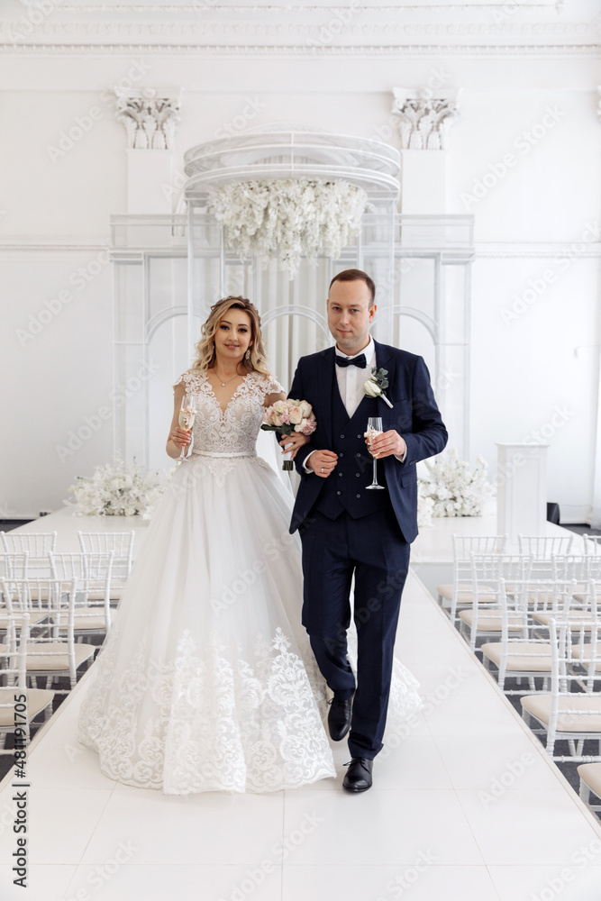 Newlyweds swear allegiance to each other. Celebration in the White Hall. Congratulations to the young. Significant day.