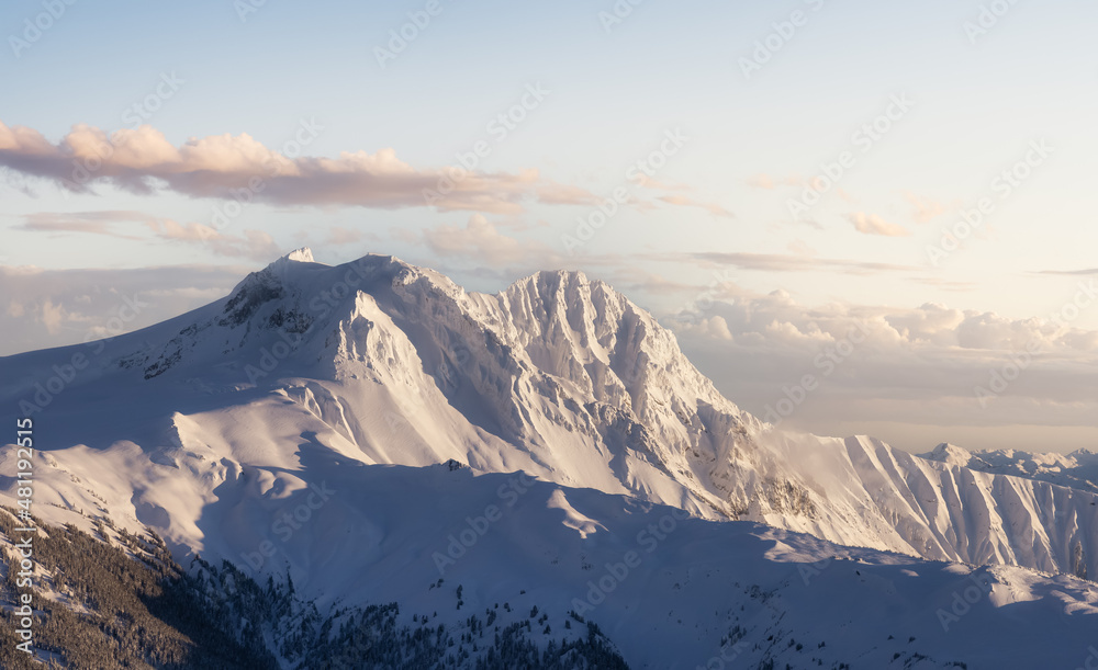 Aerial View of Canadian Mountain covered in snow. Colorful sunset Sky Art Render. Located near Squamish, North of Vancouver, British Columbia, Canada. Nature Background