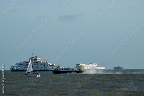 hovercraft brittany ferry and wightlink ferry passing a fort in The Solent England photo