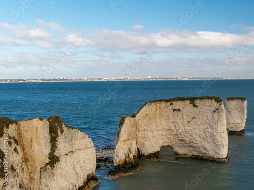 Old Harry Rocks standing tall on Handfast Point at the southern end of Studand Bay one of the most famous landmarks on the south coast photo