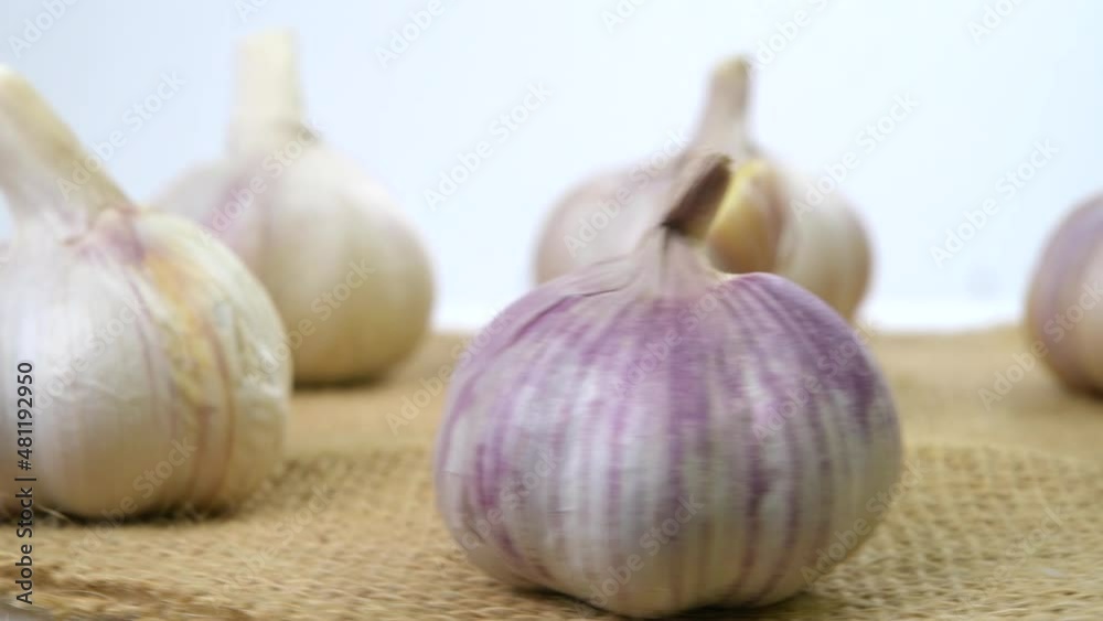 Whole Garlic Bulbs Turning on a Turntable Whole Garlic Bulbs Turning on a Turntable