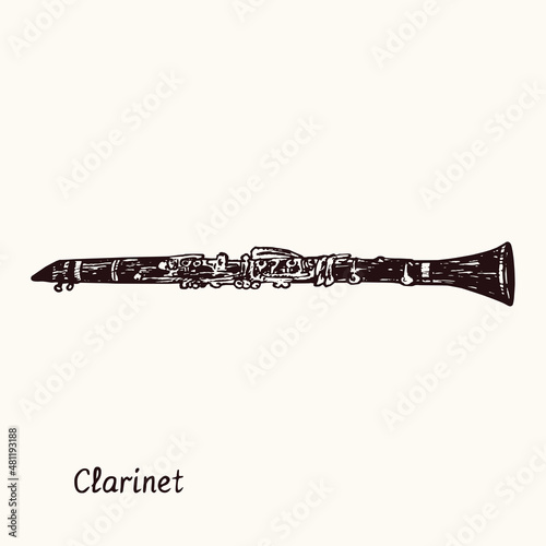 Clarinet. Ink black and white doodle drawing in woodcut style with inscription.