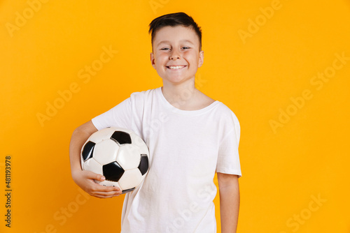 Happy smiling preteen boy in t-shirt standing © Drobot Dean