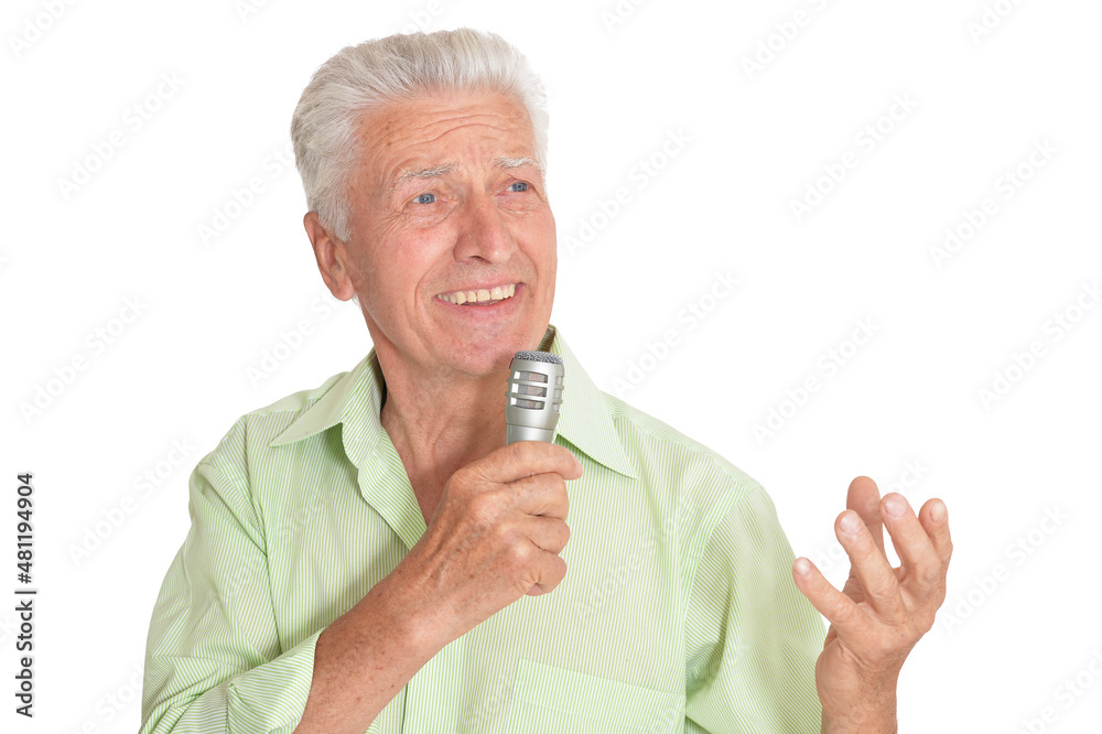 Senior man singing with microphone on white background Senior man singing with microphone on white background