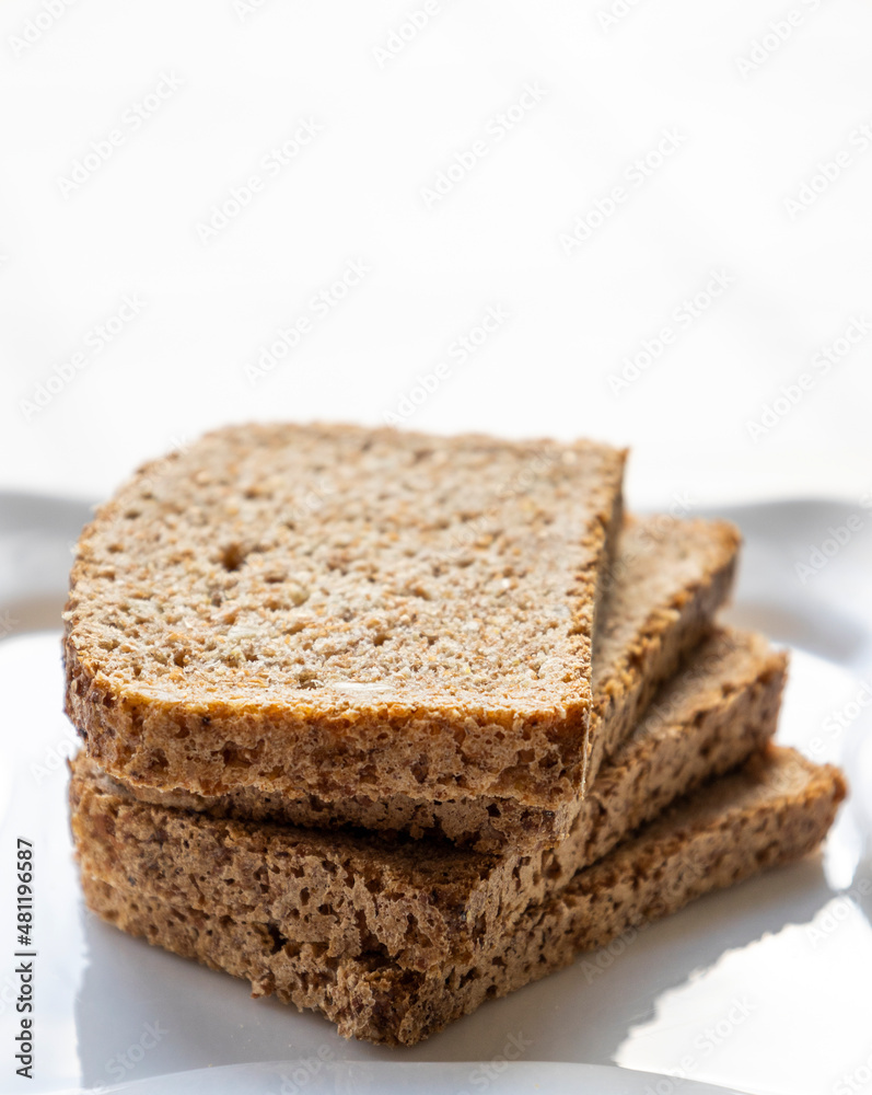 wheat bread slices close up on white background wheat bread slices close up on white background
