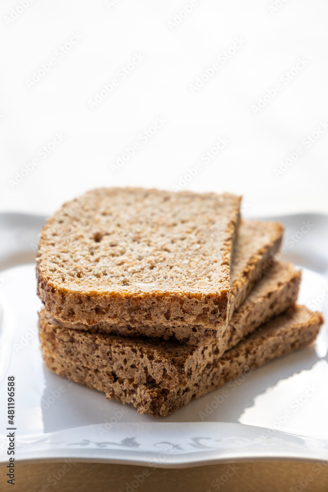 wheat bread slices close up on white background wheat bread slices close up on white background