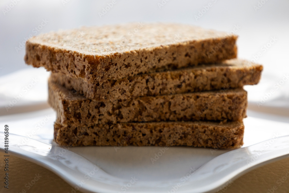 wheat bread slices close up on white background wheat bread slices close up on white background