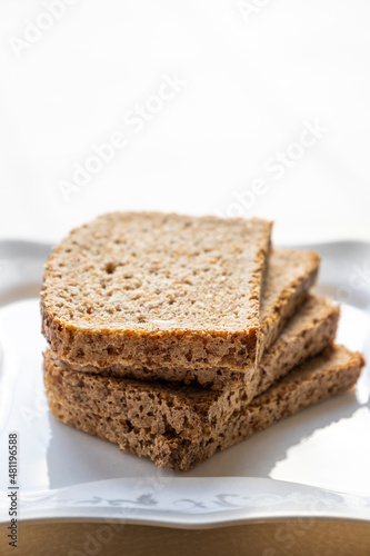wheat bread slices close up on white background