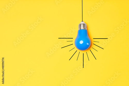 Cuadro en lienzo Concept creative idea with lightbulb on yellow background