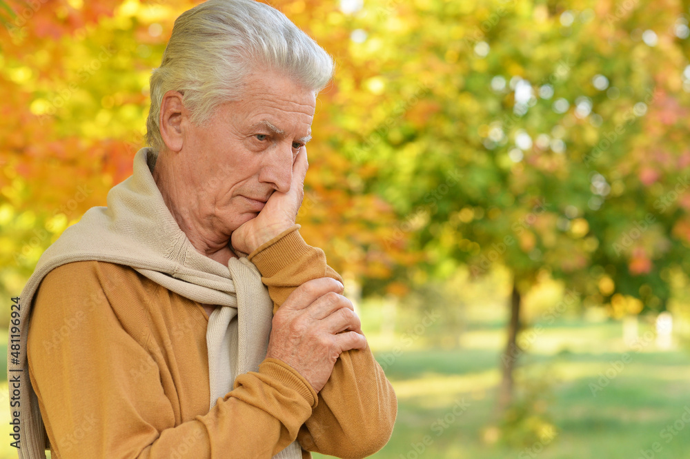 Portrait of sad senior man in park Portrait of sad senior man in park