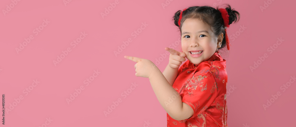 Smiling cute asian little child girls in red chinese traditional dress.Happy Chinese new year concept. Smiling cute asian little child girls in red chinese traditional dress.Happy Chinese new year concept.