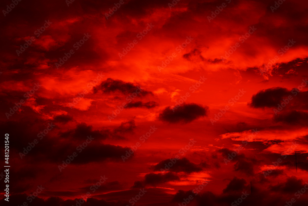 Bright red sunset. Dramatic evening sky with clouds. Fiery skies with space for design. Magic fantasy sky. War, battle, terror, world apocalypse, horror concept. Bright red sunset. Dramatic evening sky with clouds. Fiery skies with space for design. Magic fantasy sky. War, battle, terror, world apocalypse, horror concept.