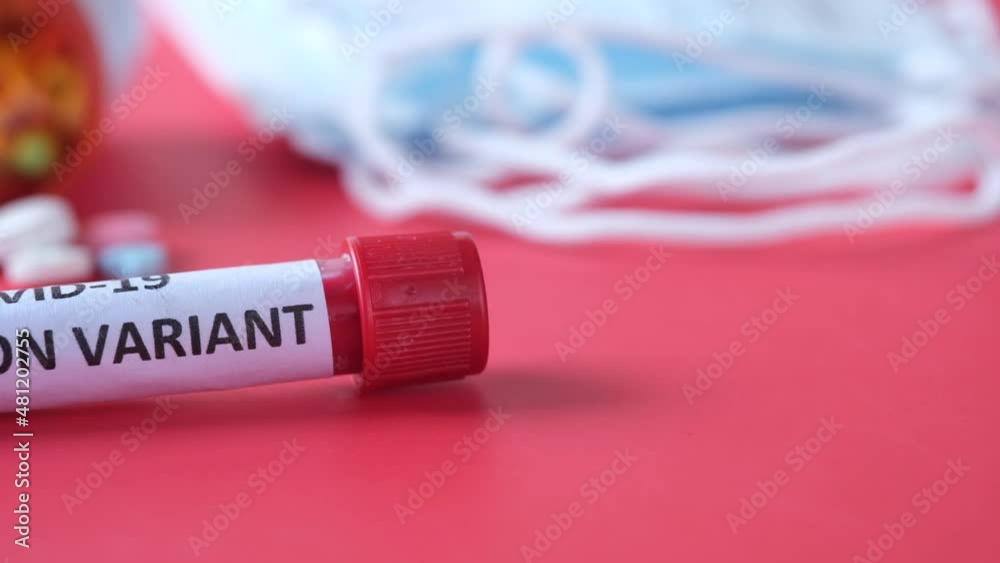 omicron variant corona virus blood test tube on red background 