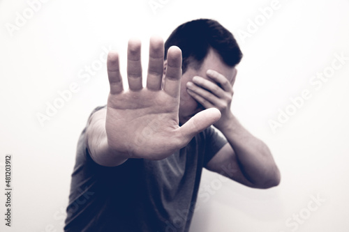 person covering his face
