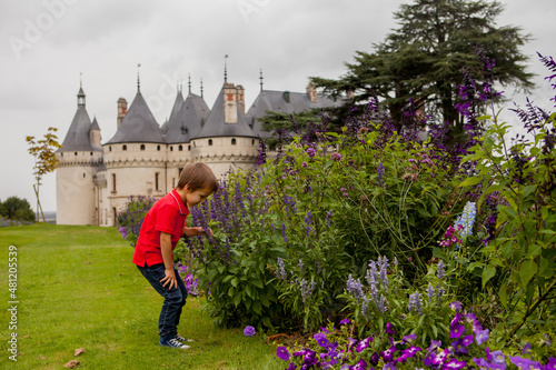 Cute boy in Chaumont gardens, smiling at camera photo