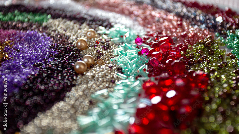 Fototapeta premium Beads banner. Multicolored beads background .Handicraft and hobby banner. Weaving and embroidery with beads concept