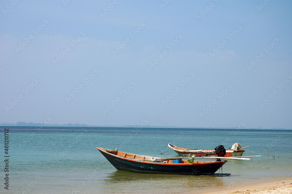 boat on the beach in clam sea