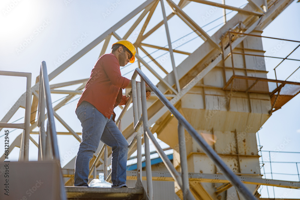 Experienced worker concentrating at his work in plant