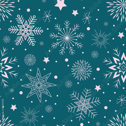 seamless pattern on a blue background white snowflakes stars and circles