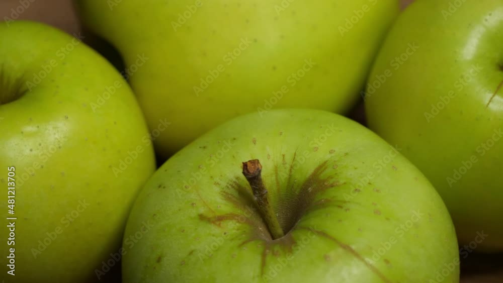 Four green apples, macro video. Apples of the Reinette Simirenko variety.
Four green apples, macro video. Apples of the Reinette Simirenko variety.