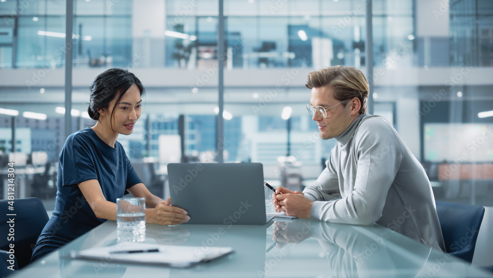 Fototapeta premium Multiethnic Diverse Office Conference Room Meeting: Team of Two Creative Entrepreneurs Talk, Discuss Growth Strategy. Stylish Young Businesspeople work on Investment and Marketing Projects.