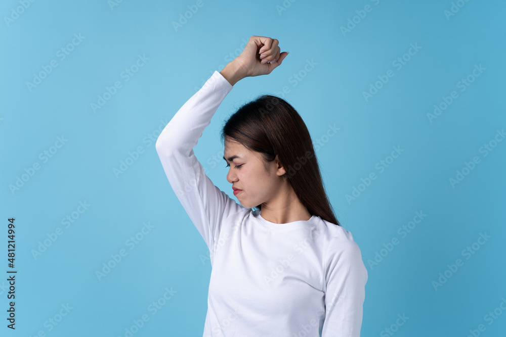 Woman smelling bad from her shirt because dirty laundry. Woman smelling bad from her shirt because dirty laundry.