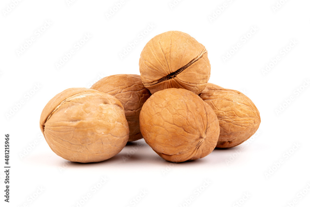 Walnuts in shells isolated on white background. Package design element with clipping path. Walnuts in shells isolated on white background. Package design element with clipping path.