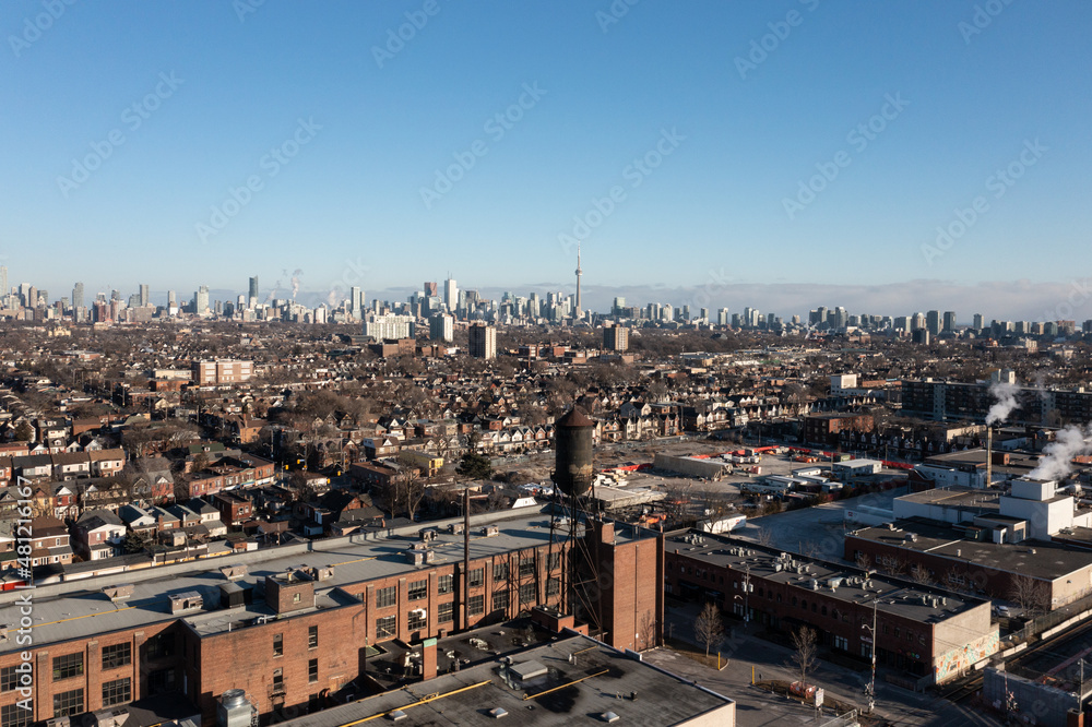 downtown Toronto, Lansdowne and Dupont,  building and water tower with CN Tower in the back skyline 