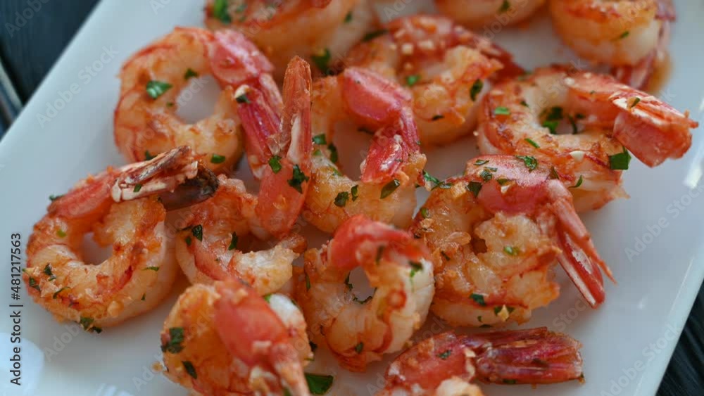 Fried shrimps with greens salt lemon and sauce on the plate Fried shrimps with greens salt lemon and sauce on the plate
