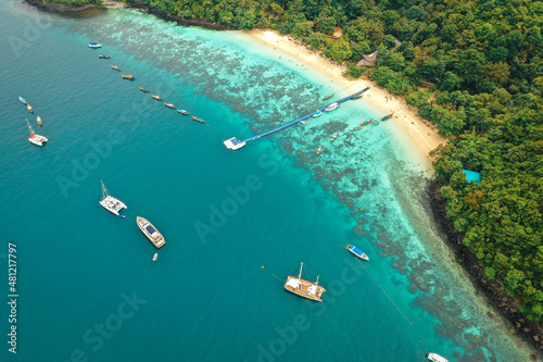 Coral island  koh He  beach and boats in Phuket province  Thailand