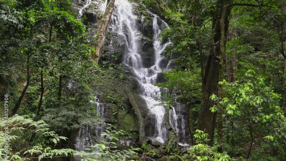 Hidden beautiful jungle waterfall at a rocky wall in the deep rainforest jungle in Rincon de la Vieja, Costa Rica. Hidden beautiful jungle waterfall at a rocky wall in the deep rainforest jungle in Rincon de la Vieja, Costa Rica.
