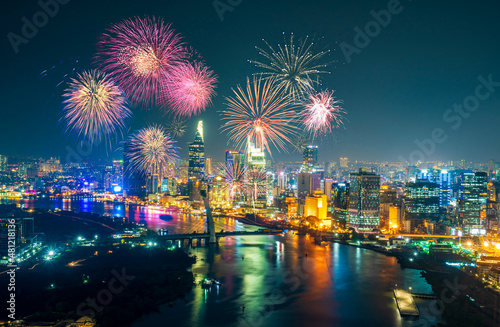 Celebration. Skyline with fireworks light up sky over business district in Ho Chi Minh City ( Saigon ), Vietnam. Beautiful night view cityscape.