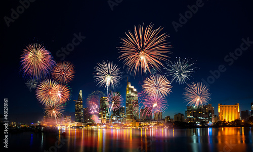 Celebration. Skyline with fireworks light up sky over business district in Ho Chi Minh City ( Saigon ), Vietnam. Beautiful night view cityscape.