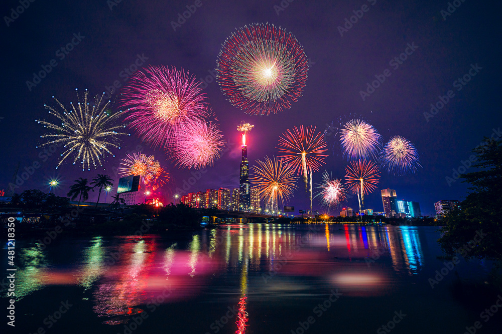 Fototapeta premium Celebration. Skyline with fireworks light up sky over Landmark 81 skyscraper in Ho Chi Minh City ( Saigon ), Vietnam. Beautiful night view cityscape.