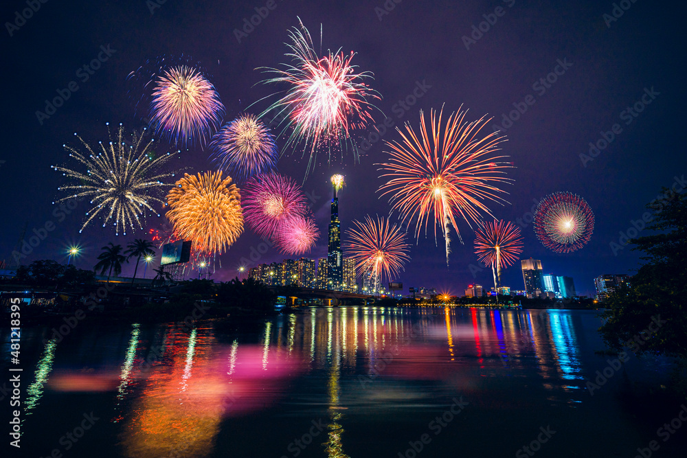 Celebration. Skyline with fireworks light up sky over Landmark 81 skyscraper in Ho Chi Minh City ( Saigon ), Vietnam. Beautiful night view cityscape. Celebration. Skyline with fireworks light up sky over Landmark 81 skyscraper in Ho Chi Minh City ( Saigon ), Vietnam. Beautiful night view cityscape.