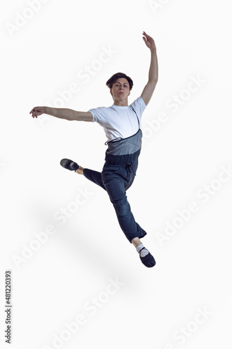 Ballet Dance Concepts. Professional Caucasian Male Ballet Dance Performing in Flight With Hands Outspread in Studio Against White Background. © danmorgan12