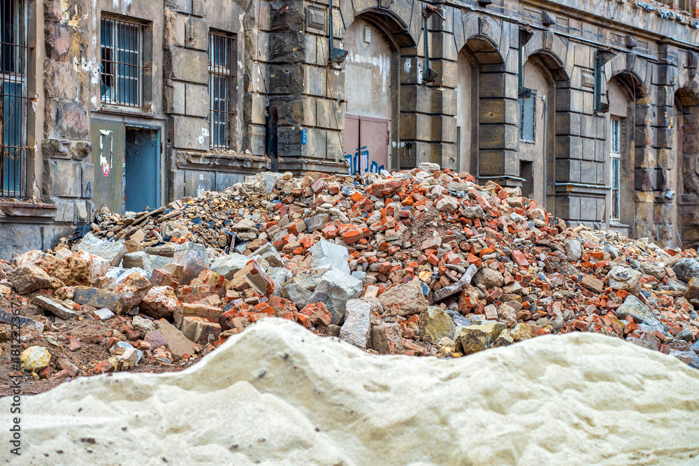 Destruction concept. Destroyed building, earthquake, pile of rubble and ...