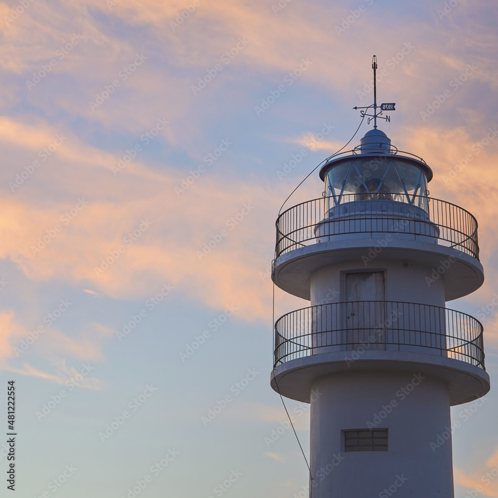 Tourinan Lighthouse in Muxia, Galician coast, Spain. Twice a year, at the beginning of spring and the end of summer, Cape Touriñan becomes the last shadow for the sunset in continental Europe.