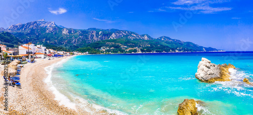 Fototapeta Naklejka Na Ścianę i Meble -  Samos island, Greece. Beautiful beach in scenic Kokkari village. popular tourist destination for summer holidays
