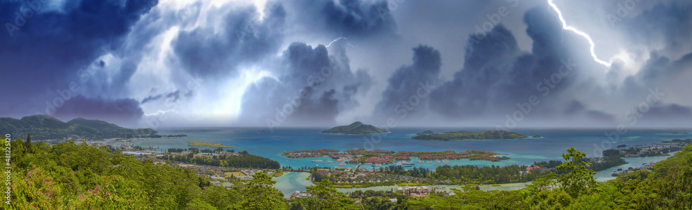 Panoramic aerial view of Eden Island and Mahe seascape from the hill during a storm, Seychelles.