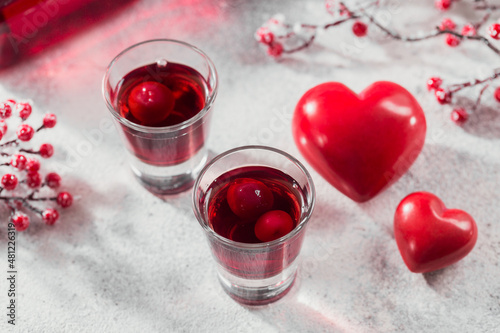 Red cocktail, vodka or liqueur and Heart shape decorations
